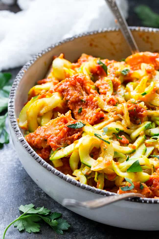 Zucchini pasta is tossed with a filling and flavor-packed, no cook creamy sun-dried tomato and scallion sauce plus perfectly cooked chicken. A tasty Paleo, Whole30 and low carb meal that's great hot or cold. Perfect for spring and summer!