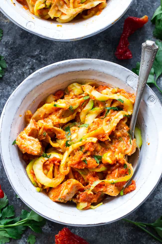 Zucchini pasta is tossed with a filling and flavor-packed, no cook creamy sun-dried tomato and scallion sauce plus perfectly cooked chicken. A tasty Paleo, Whole30 and low carb meal that's great hot or cold. Perfect for spring and summer!