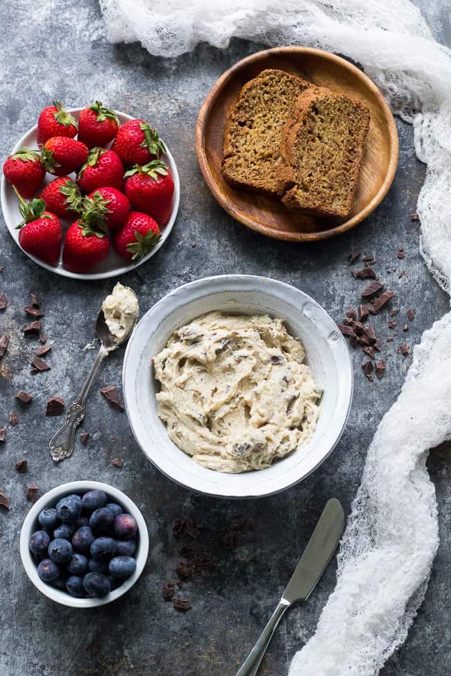 This super quick and easy cashew-based chocolate chip cheesecake dip (or spread!) is perfect for healthy sweet snacks and desserts. No need to make a whole cheesecake when a craving hits! This versatile dip/spread is dairy-free, paleo, vegan, and loaded with creamy texture and dark chocolate.