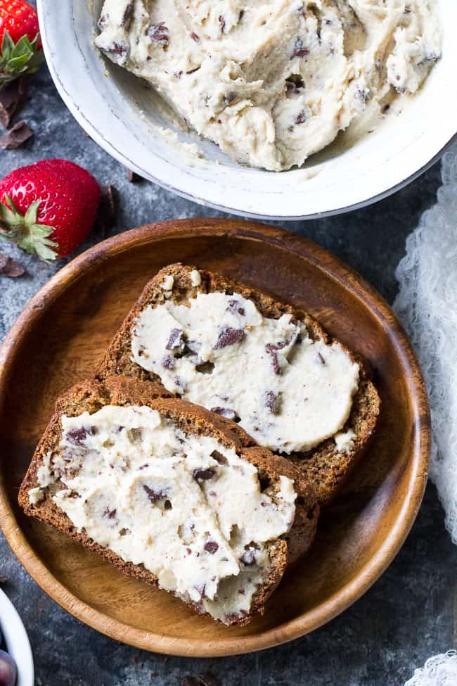 This super quick and easy cashew-based chocolate chip cheesecake dip (or spread!) is perfect for healthy sweet snacks and desserts. No need to make a whole cheesecake when a craving hits! This versatile dip/spread is dairy-free, paleo, vegan, and loaded with creamy texture and dark chocolate.