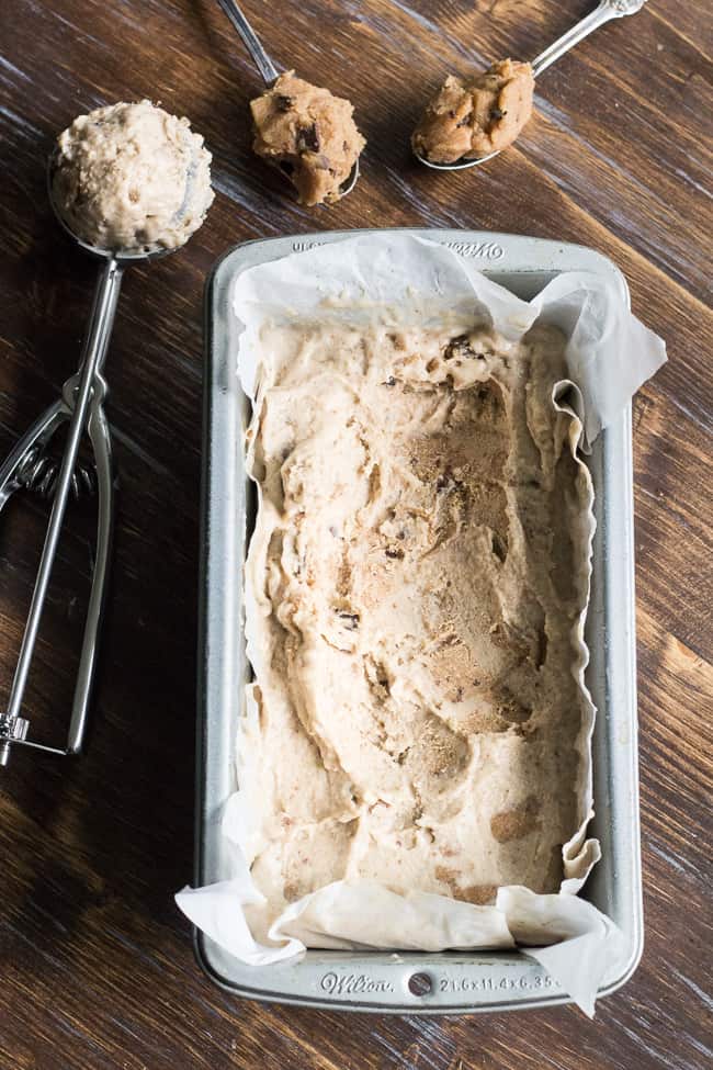 This no-churn chocolate chip cookie dough paleo & vegan ice cream is creamy and loaded with chewy cookie dough bites, yet secretly so healthy!  The ice cream base is sweetened with dates and bananas and comes together quickly in a blender.  The cookie dough takes two minutes to make and is grain free and dairy free.   It's a healthy and addicting frozen treat that you'll want to make again and again!