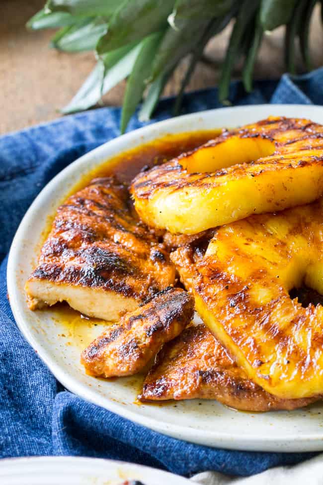 This Paleo pineapple chicken has a sweet pineapple glaze with a Whole30 friendly option too! It's easy, healthy, kid approved and perfect for summer grilling. It can also be made stovetop in a grill-pan. Refined sugar, free gluten-free and dairy-free.