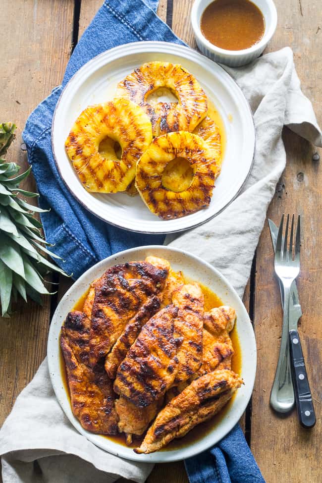 This Paleo pineapple chicken has a sweet pineapple glaze with a Whole30 friendly option too! It's easy, healthy, kid approved and perfect for summer grilling. It can also be made stovetop in a grill-pan. Refined sugar, free gluten-free and dairy-free.