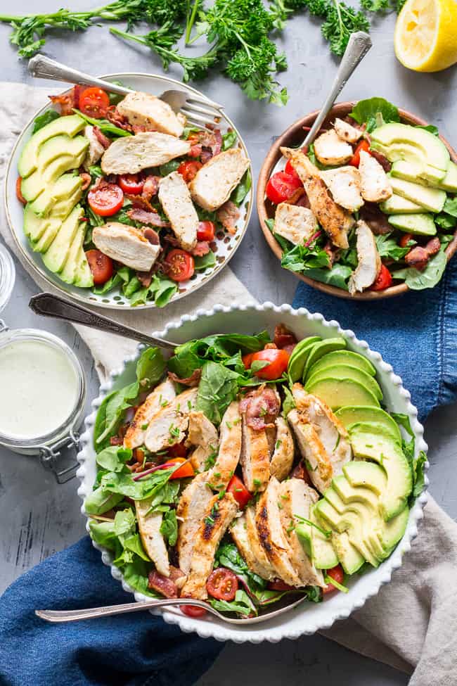 This grilled chicken BLT salad includes all your favorites - crispy bacon, perfectly seasoned grilled chicken, cherry tomatoes, and avocado! It's topped with a healthy paleo & Whole30 friendly peppercorn ranch that might just become your new favorite salad dressing! Dairy-free, gluten-free, even kid approved!