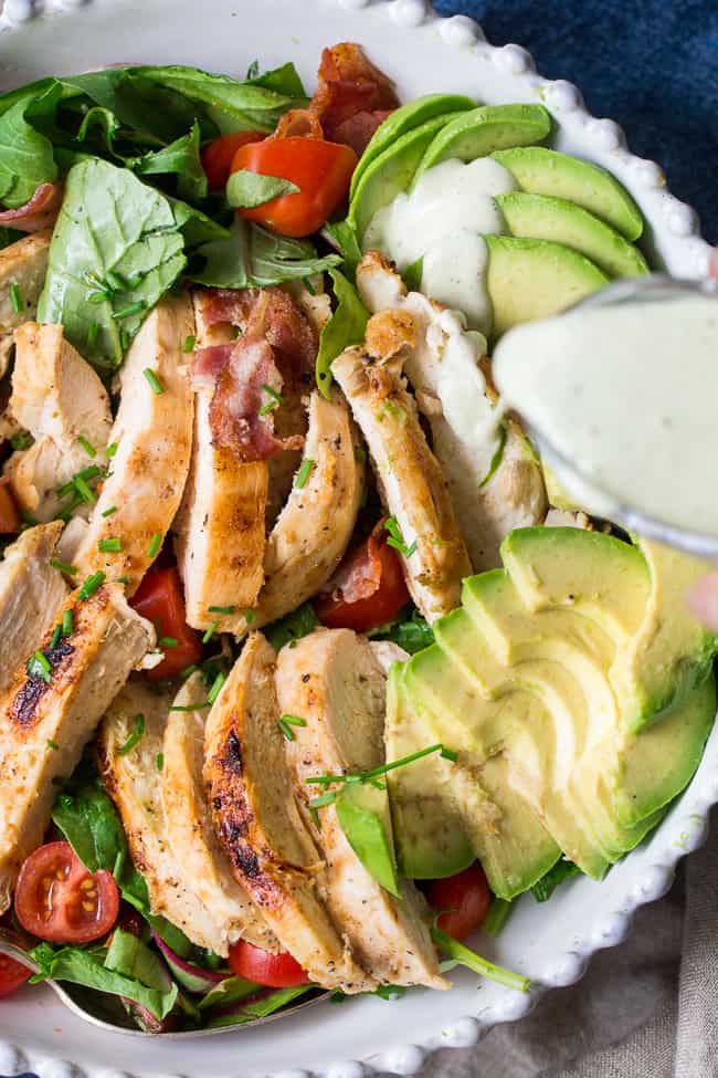 This grilled chicken BLT salad includes all your favorites - crispy bacon, perfectly seasoned grilled chicken, cherry tomatoes, and avocado! It's topped with a healthy paleo & Whole30 friendly peppercorn ranch that might just become your new favorite salad dressing! Dairy-free, gluten-free, even kid approved!