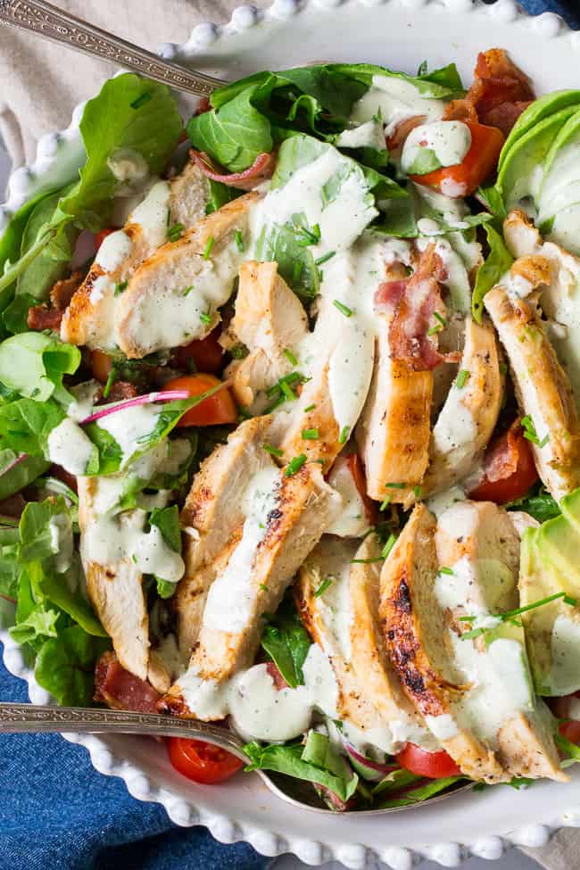 This grilled chicken BLT salad includes all your favorites - crispy bacon, perfectly seasoned grilled chicken, cherry tomatoes, and avocado! It's topped with a healthy paleo & Whole30 friendly peppercorn ranch that might just become your new favorite salad dressing! Dairy-free, gluten-free, even kid approved!