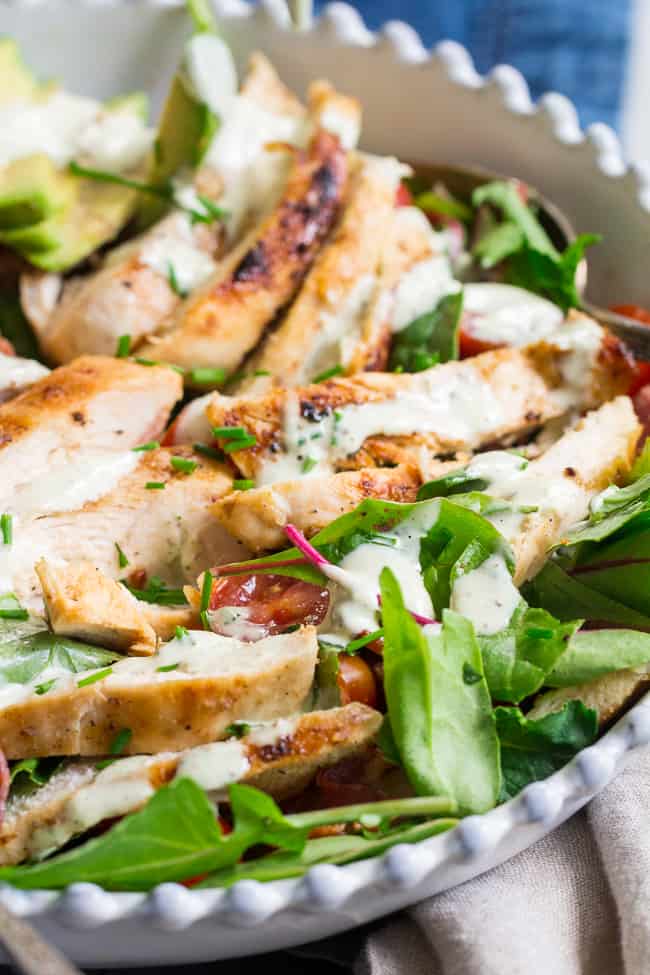 This grilled chicken BLT salad includes all your favorites - crispy bacon, perfectly seasoned grilled chicken, cherry tomatoes, and avocado! It's topped with a healthy paleo & Whole30 friendly peppercorn ranch that might just become your new favorite salad dressing! Dairy-free, gluten-free, even kid approved!