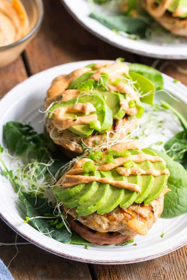 hese Chipotle Ranch Chicken Burgers are loaded with your favorite flavors and perfect on a grilled sweet potato bun!  Topped with chipotle ranch sauce, avocado and sprouts for a delicious, fun, and healthy burger that might become your new favorite!  Paleo, Whole30, gluten-free, dairy-free.
