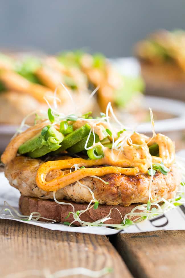 hese Chipotle Ranch Chicken Burgers are loaded with your favorite flavors and perfect on a grilled sweet potato bun!  Topped with chipotle ranch sauce, avocado and sprouts for a delicious, fun, and healthy burger that might become your new favorite!  Paleo, Whole30, gluten-free, dairy-free.