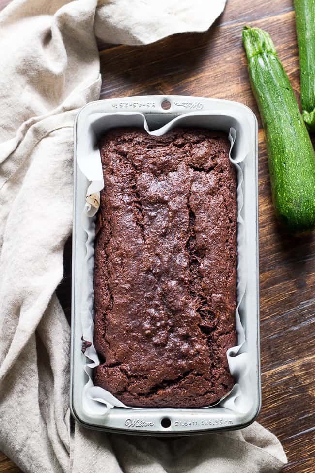 This super moist and rich double chocolate zucchini bread tastes like dessert but is secretly healthy, Paleo, free of refined sugar, grain free, gluten free and dairy free. It's kid approved and great for snacks and even breakfast! 