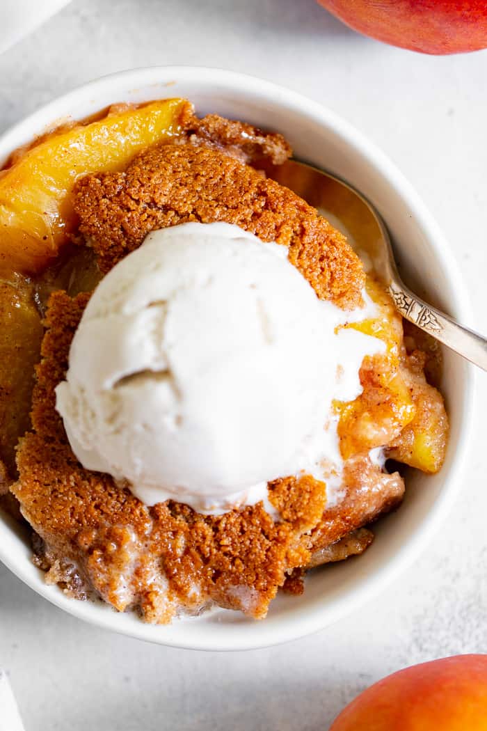 Take advantage of peach season with this paleo and vegan peach cobbler!  It's sweetened with unrefined coconut sugar and spiced with a touch of sweet cinnamon, with a warm and crisp grain-free pastry topping that's downright addicting.  A great gluten free, dairy free, egg free dessert for summer!