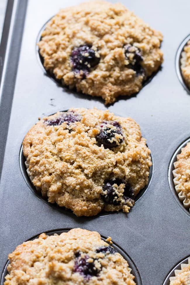 These Paleo Blueberry Muffins have classic flavor and texture plus the perfect crumb top - it's downright addicting!   Have one freshly baked or make them ahead of time and enjoy as a part of your breakfast or a grab-n-go snack.  They're grain free, dairy free, gluten-free and refined sugar free.