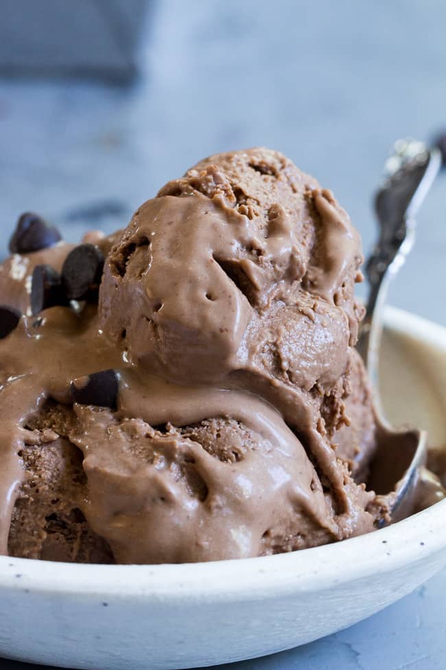 This no-churn chocolate coconut milk ice cream is so rich and creamy that you'd never guess it's vegan and paleo!  Almond butter adds creaminess to the texture and raw cacao plus pure maple syrup give this coconut milk ice cream a rich dark chocolate flavor.  Dairy-free, soy free, refined-sugar-free, easy to make!