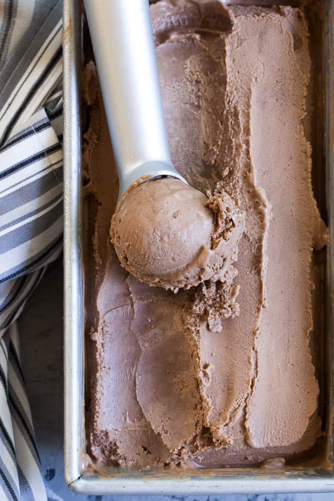 This no-churn chocolate coconut milk ice cream is so rich and creamy that you'd never guess it's vegan and paleo!  Almond butter adds creaminess to the texture and raw cacao plus pure maple syrup give this coconut milk ice cream a rich dark chocolate flavor.  Dairy-free, soy free, refined-sugar-free, easy to make!