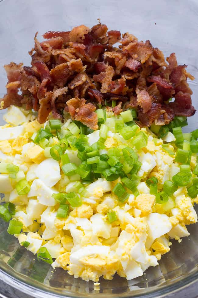 This super simple, classic paleo egg salad will become a new favorite for your whole family!  Prepared with sugar-free bacon and 1-minute homemade mayo, this egg salad is Whole30 compliant, low carb, and delicious over a green salad or in lettuce wraps!  Perfect to make ahead for weekday lunches. 