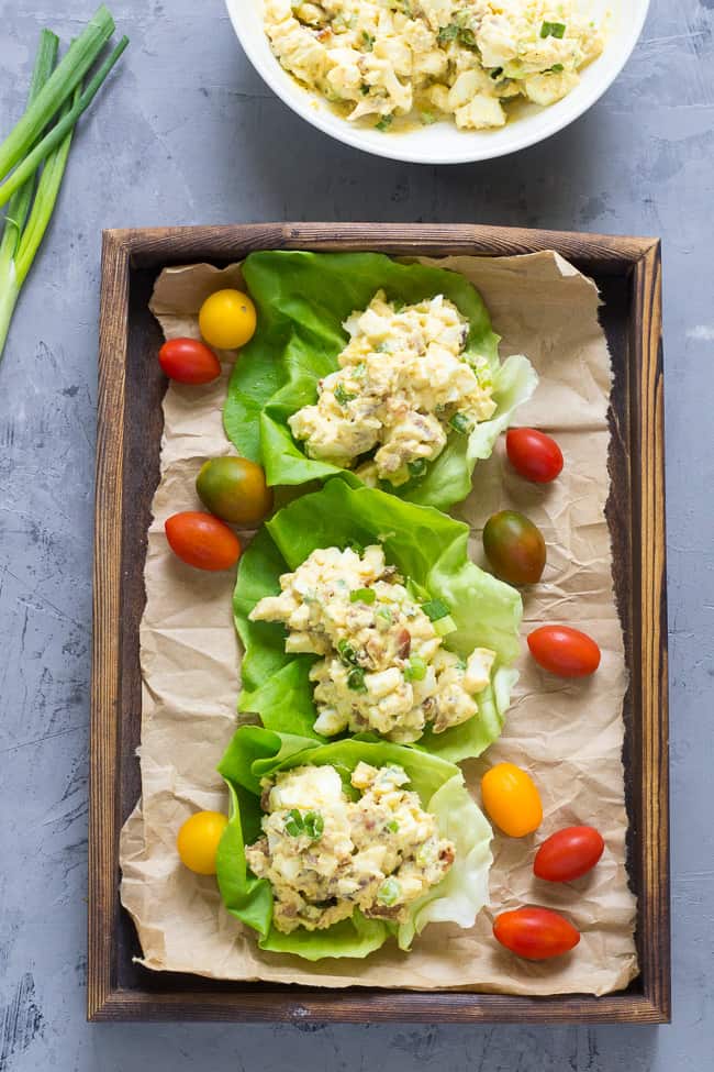 This super simple, classic paleo egg salad will become a new favorite for your whole family!  Prepared with sugar-free bacon and 1-minute homemade mayo, this egg salad is Whole30 compliant, low carb, and delicious over a green salad or in lettuce wraps!  Perfect to make ahead for weekday lunches. 