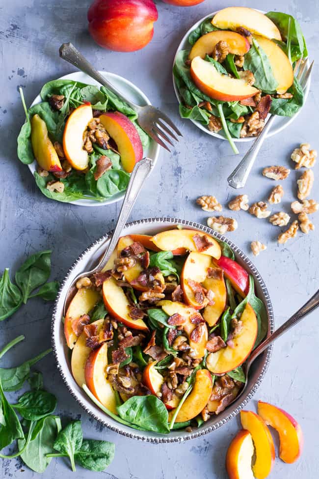 This fresh nectarine and spinach salad is loaded with so many goodies!  Crispy bacon, toasted walnuts and an easy Whole30 friendly balsamic vinaigrette.  You can make it a filling meal by adding grilled chicken or serve on its own.  Paleo, no added sugar and Whole30 compliant. 