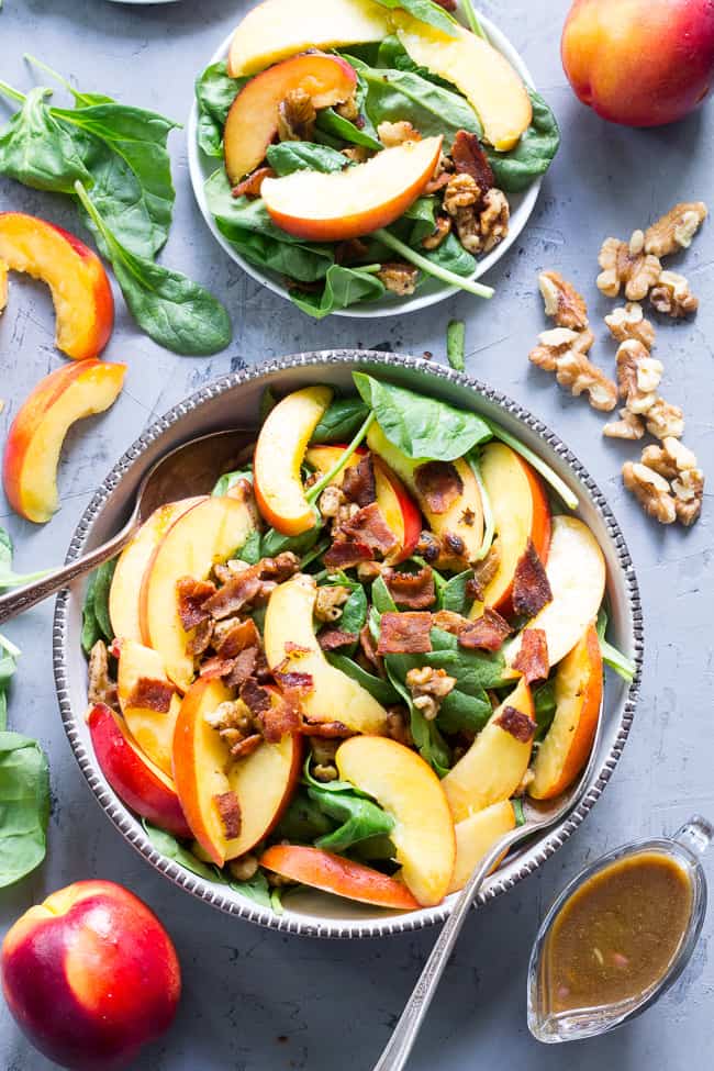 This fresh nectarine and spinach salad is loaded with so many goodies!  Crispy bacon, toasted walnuts and an easy Whole30 friendly balsamic vinaigrette.  You can make it a filling meal by adding grilled chicken or serve on its own.  Paleo, no added sugar and Whole30 compliant. 