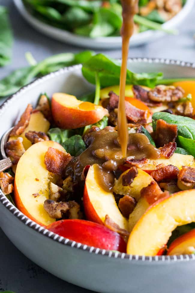 This fresh nectarine and spinach salad is loaded with so many goodies!  Crispy bacon, toasted walnuts and an easy Whole30 friendly balsamic vinaigrette.  You can make it a filling meal by adding grilled chicken or serve on its own.  Paleo, no added sugar and Whole30 compliant. 