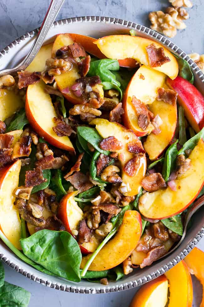 This fresh nectarine and spinach salad is loaded with so many goodies!  Crispy bacon, toasted walnuts and an easy Whole30 friendly balsamic vinaigrette.  You can make it a filling meal by adding grilled chicken or serve on its own.  Paleo, no added sugar and Whole30 compliant. 