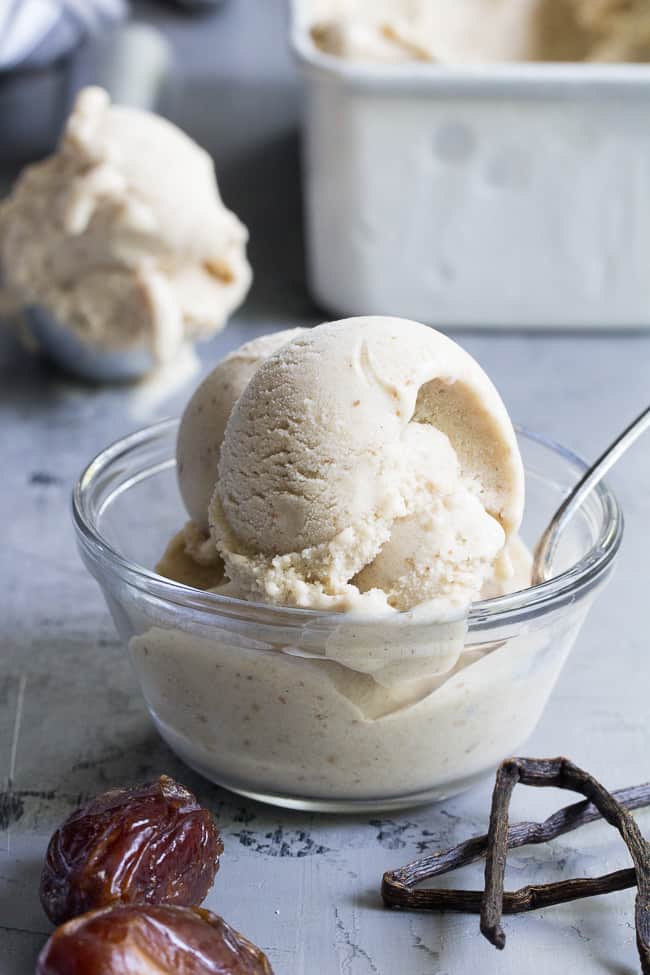 This dairy-free vanilla bean ice cream is made with coconut milk & cream and sweetened with dates for a naturally creamy texture and sweet flavor.  It's paleo and vegan, soy free and contains no refined sugar.  This healthy dessert is packed with vanilla flavor and ready for all your favorite toppings! 