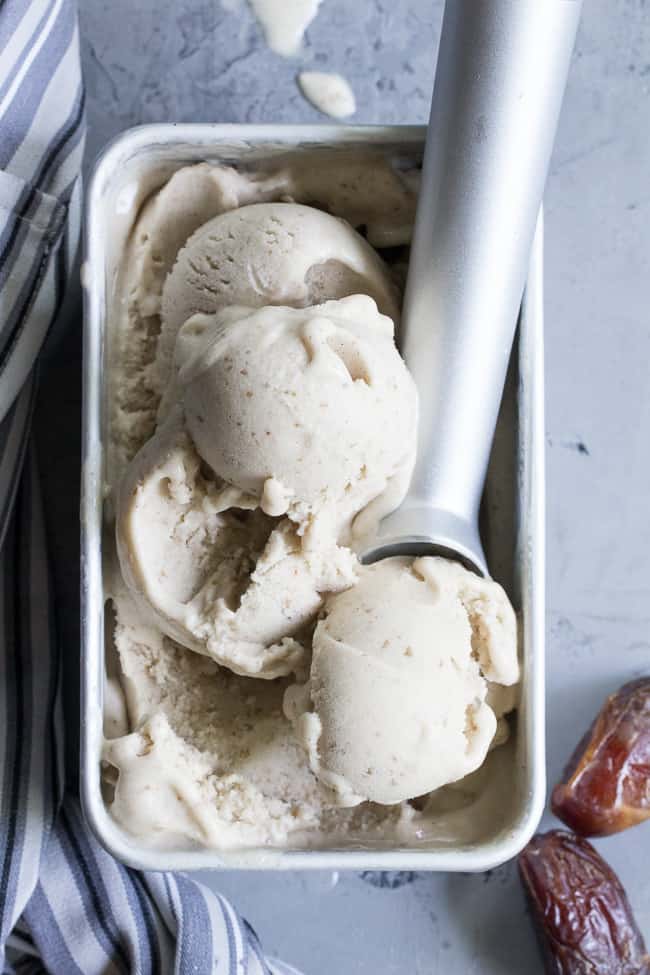 This dairy-free vanilla bean ice cream is made with coconut milk & cream and sweetened with dates for a naturally creamy texture and sweet flavor.  It's paleo and vegan, soy free and contains no refined sugar.  This healthy dessert is packed with vanilla flavor and ready for all your favorite toppings! 