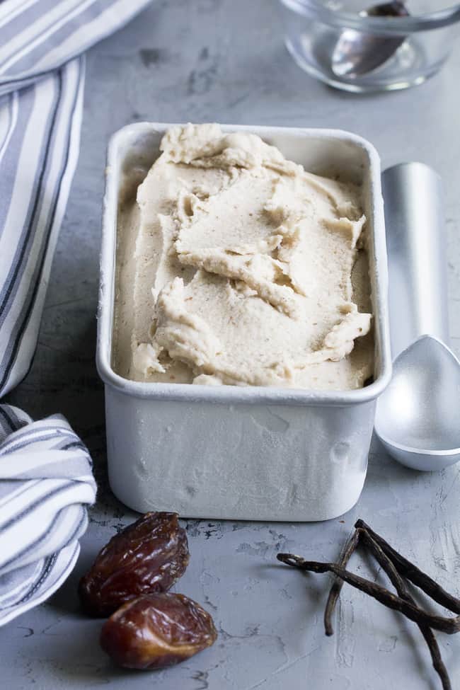 This dairy-free vanilla bean ice cream is made with coconut milk & cream and sweetened with dates for a naturally creamy texture and sweet flavor.  It's paleo and vegan, soy free and contains no refined sugar.  This healthy dessert is packed with vanilla flavor and ready for all your favorite toppings! 