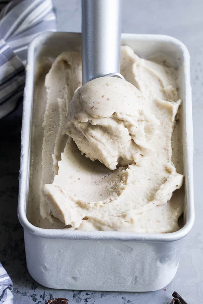 This dairy-free vanilla bean ice cream is made with coconut milk & cream and sweetened with dates for a naturally creamy texture and sweet flavor.  It's paleo and vegan, soy free and contains no refined sugar.  This healthy dessert is packed with vanilla flavor and ready for all your favorite toppings! 