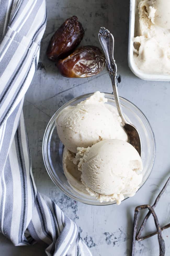 This dairy-free vanilla bean ice cream is made with coconut milk & cream and sweetened with dates for a naturally creamy texture and sweet flavor.  It's paleo and vegan, soy free and contains no refined sugar.  This healthy dessert is packed with vanilla flavor and ready for all your favorite toppings! 