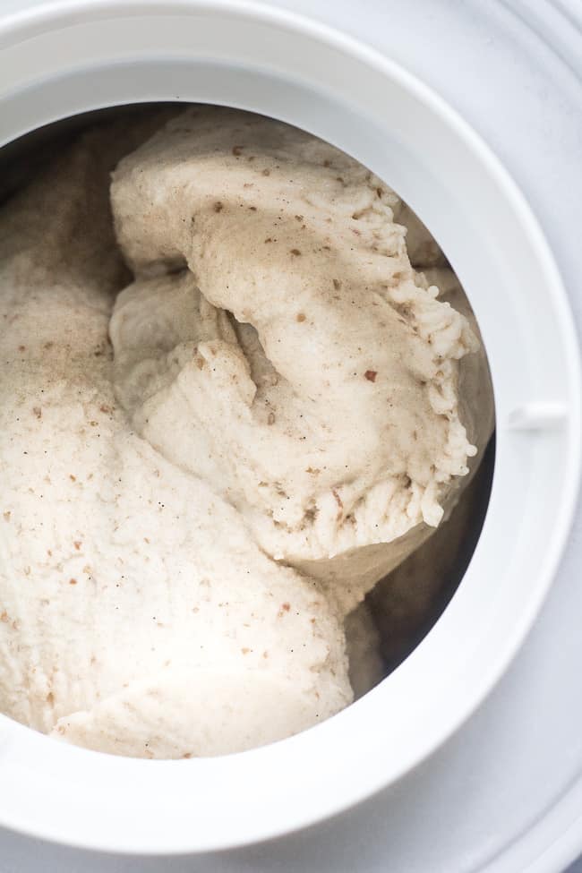 This dairy-free vanilla bean ice cream is made with coconut milk & cream and sweetened with dates for a naturally creamy texture and sweet flavor.  It's paleo and vegan, soy free and contains no refined sugar.  This healthy dessert is packed with vanilla flavor and ready for all your favorite toppings! 