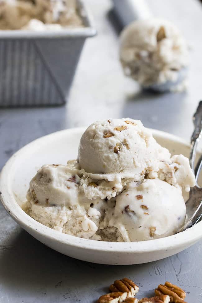 This "butter" pecan vegan ice cream is thick, creamy and decadently sweet yet made with no refined sugar or dairy. You won't believe you're not eating the real thing once you taste it!  Paleo, vegan, gluten free, dairy-free.