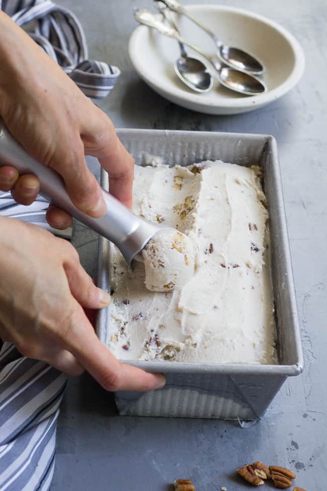 This "butter" pecan vegan ice cream is thick, creamy and decadently sweet yet made with no refined sugar or dairy. You won't believe you're not eating the real thing once you taste it!  Paleo, vegan, gluten free, dairy-free.