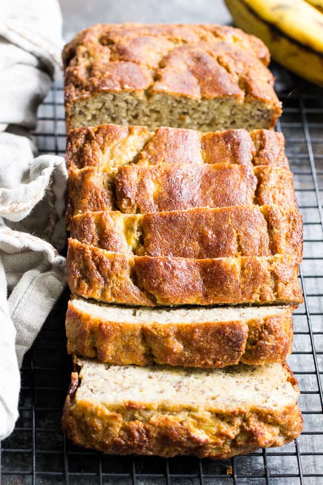 This deliciously hearty yet soft and moist Paleo banana bread is made with no grains, dairy, and no added sugar.  It's gluten free, Paleo and sweetened only with bananas and perfect for breakfast or a snack with your favorite spread.  Kid approved and easy to make!