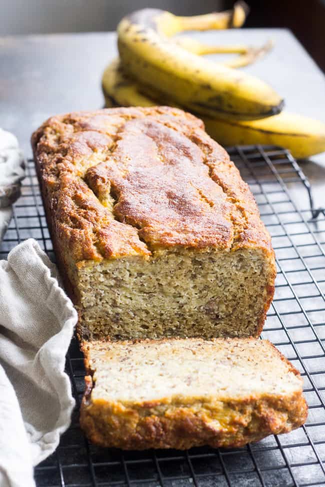 This deliciously hearty yet soft and moist Paleo banana bread is made with no grains, dairy, and no added sugar.  It's gluten free, Paleo and sweetened only with bananas and perfect for breakfast or a snack with your favorite spread.  Kid approved and easy to make!