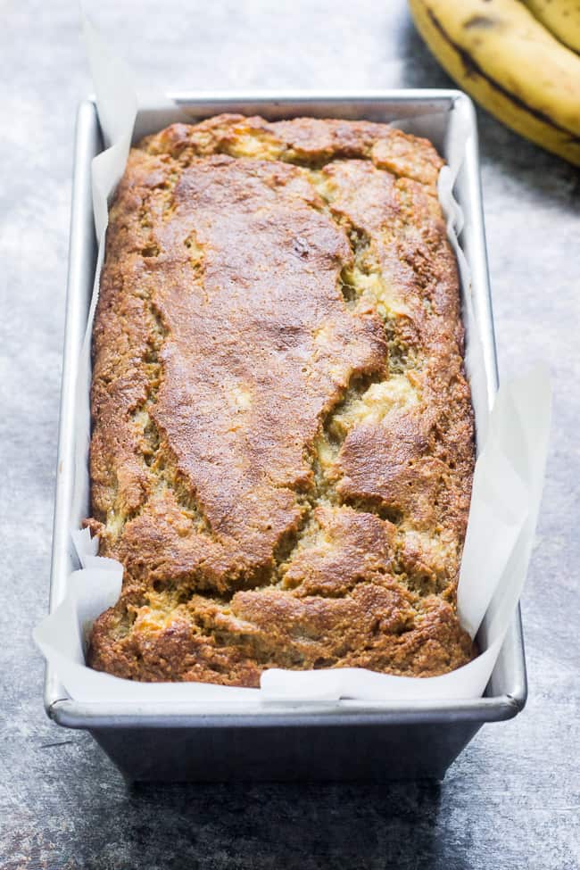 This deliciously heart yet soft and moist Paleo banana bread is made with no grains, dairy, and no added sugar.  It's gluten free, Paleo and sweetened only with bananas and perfect for breakfast or a snack with your favorite spread.  Kid approved and easy to make!