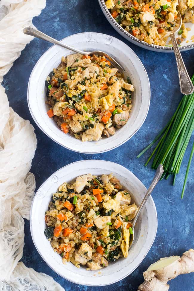 This cauliflower fried rice tastes just like the real thing (maybe better!) but it's much healthier and easy to make at home.  Loaded with flavor, protein, veggies and healthy fats, it makes a great weeknight meal that everyone will love.  Paleo, Whole30 compliant, low carb, kid approved!