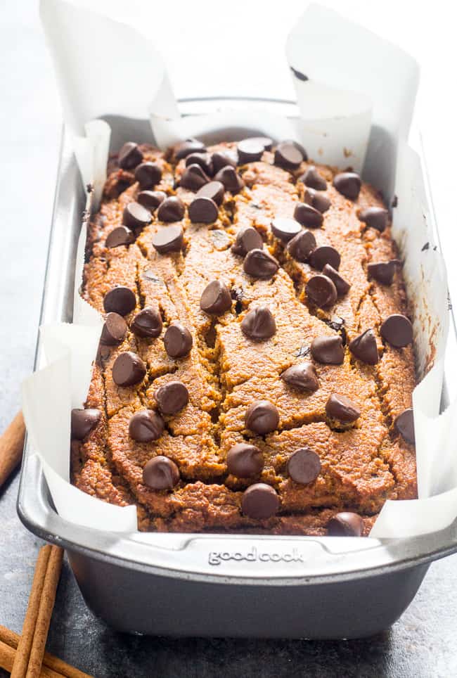 This paleo pumpkin bread is perfectly soft, tender, moist and full of sweet spices and dark chocolate chips.  It's made with coconut flour, grain free, dairy free and nut free.  Kid approved too and great for after school snacks and even breakfast!