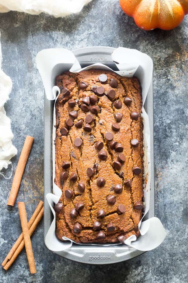 This paleo pumpkin bread is perfectly soft, tender, moist and full of sweet spices and dark chocolate chips.  It's made with coconut flour, grain free, dairy free and nut free.  Kid approved too and great for after school snacks and even breakfast!