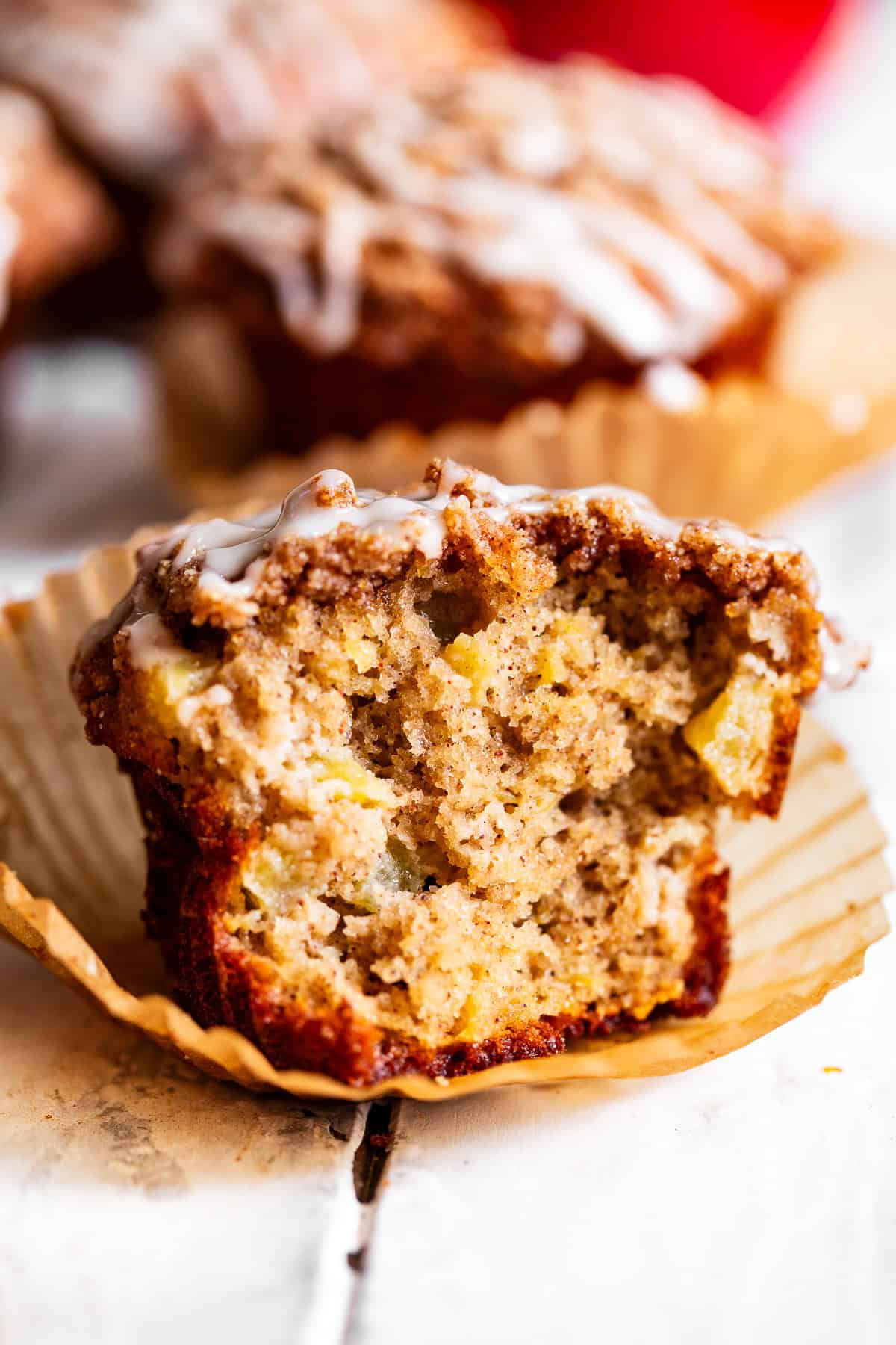 Close-up of a gluten-free apple crumb muffin topped with chunky cinnamon almond flour crumble.