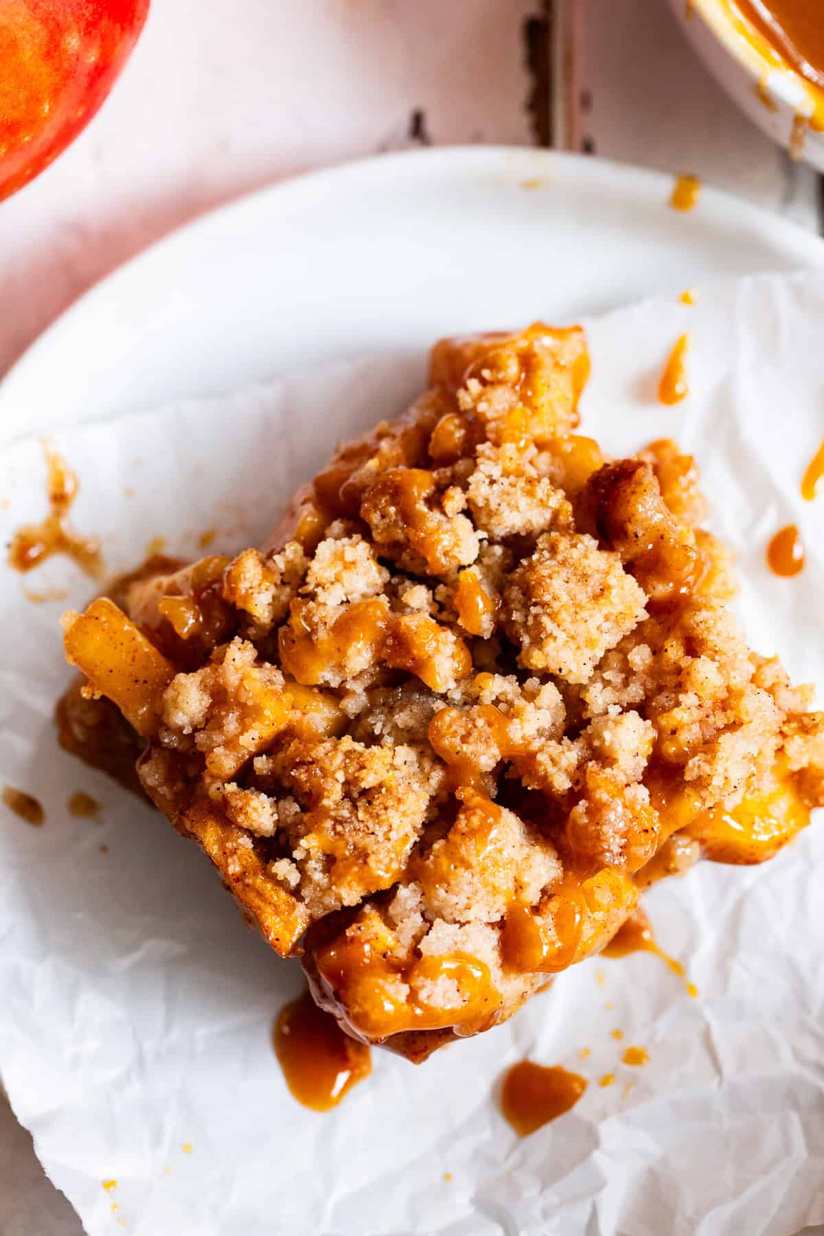 Gluten free apple pie bar showing almond flour crust, apple filling and crumble