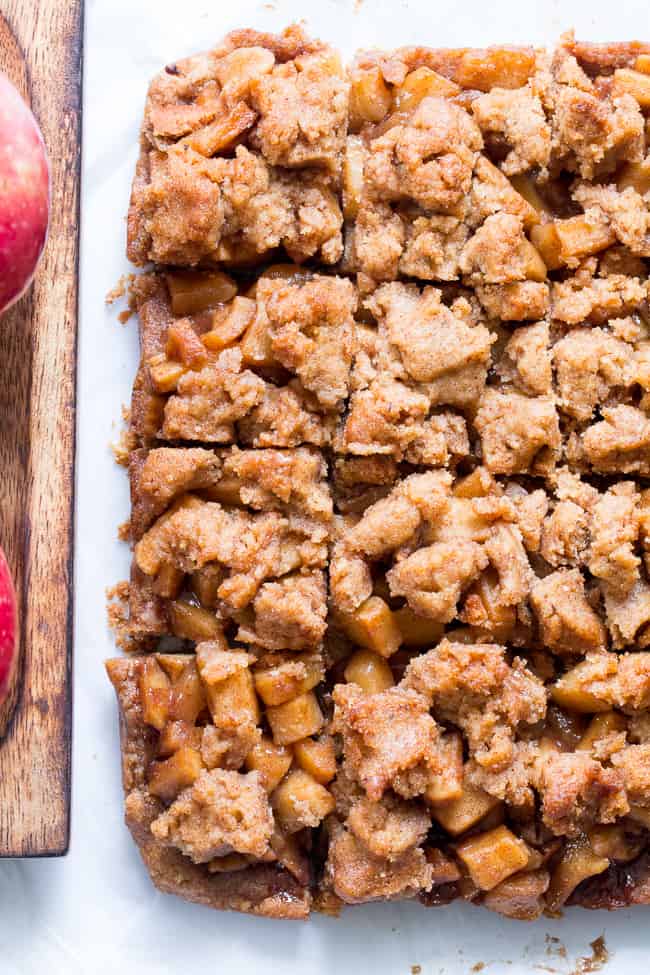 These Paleo apple pie bars have a delicious almond butter crust and crumb top and perfect apple pie filling! They're a fun fall dessert to make and eat with kids, gluten-free, dairy-free, paleo and vegan.
