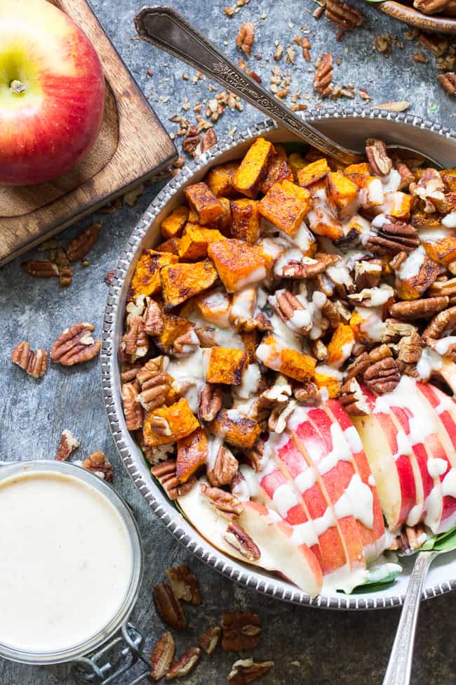 This sweet and savory roasted butternut salad is loaded with goodies! Perfectly caramelized butternut squash tossed with crisp sweet apples, pecans and raisins with a creamy homemade dairy-free buttermilk dressing using @NaturesIntentv! Paleo, vegan, and Whole30 compliant, too. #AD #NaturesIntentVinegar