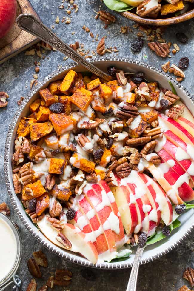 This sweet and savory roasted butternut salad is loaded with goodies! Perfectly caramelized butternut squash tossed with crisp sweet apples, pecans and raisins with a creamy homemade dairy-free buttermilk dressing using @NaturesIntentv! Paleo, vegan, and Whole30 compliant, too. #AD #NaturesIntentVinegar