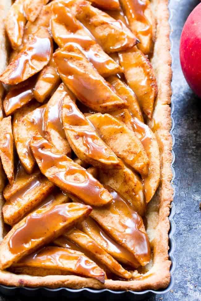 This gorgeous salted caramel apple tart is an irresistible fall dessert and easier than you think!  It begins with a buttery grain free pastry crust filled with juicy apples and topped with an easy dairy free salted caramel sauce.  Gluten free, grain free, dairy-free option, paleo, and family approved!