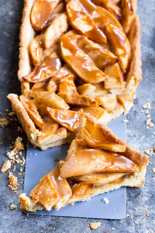 This gorgeous salted caramel apple tart is an irresistible fall dessert and easier than you think!  It begins with a buttery grain free pastry crust filled with juicy apples and topped with an easy dairy free salted caramel sauce.  Gluten free, grain free, dairy-free option, paleo, and family approved!