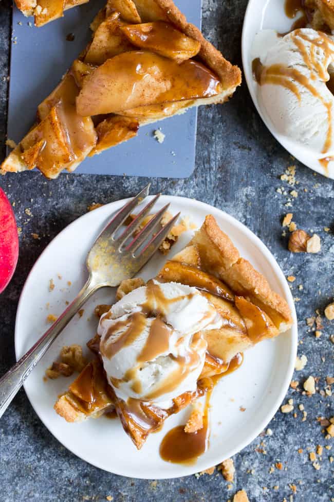 This gorgeous salted caramel apple tart is an irresistible fall dessert and easier than you think!  It begins with a buttery grain free pastry crust filled with juicy apples and topped with an easy dairy free salted caramel sauce.  Gluten free, grain free, dairy-free option, paleo, and family approved!