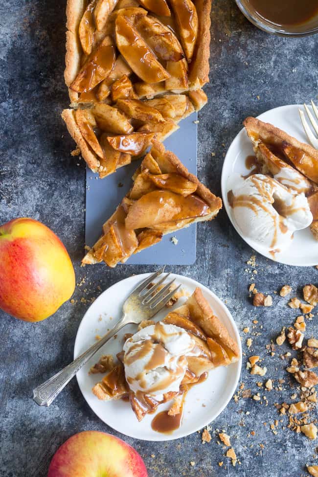 This gorgeous salted caramel apple tart is an irresistible fall dessert and easier than you think!  It begins with a buttery grain free pastry crust filled with juicy apples and topped with an easy dairy free salted caramel sauce.  Gluten free, grain free, dairy-free option, paleo, and family approved!
