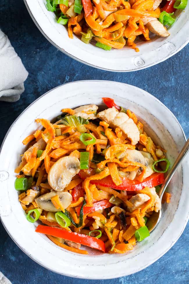 This paleo and Whole30 spin on veggie and pork lo mein uses sweet potato noodles for a delicious real-food meal packed with the traditional flavors of garlic, sesame and ginger.  High in protein, fiber, and healthy fats for a filling lunch or dinner that's grain free, soy free, gluten-free and paleo! 