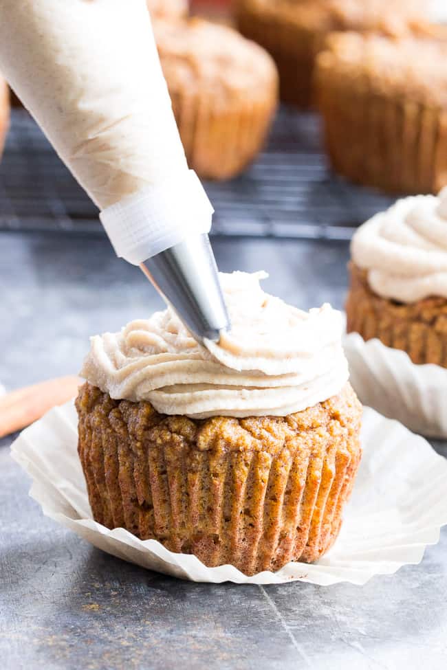 These Paleo Pumpkin Cupcakes are soft, moist, sweet, perfectly spiced, and topped with a dairy-free maple cinnamon "cream cheese" frosting!  These healthy grain free sweet treats are easy to make, great for kids and perfect for autumn.  