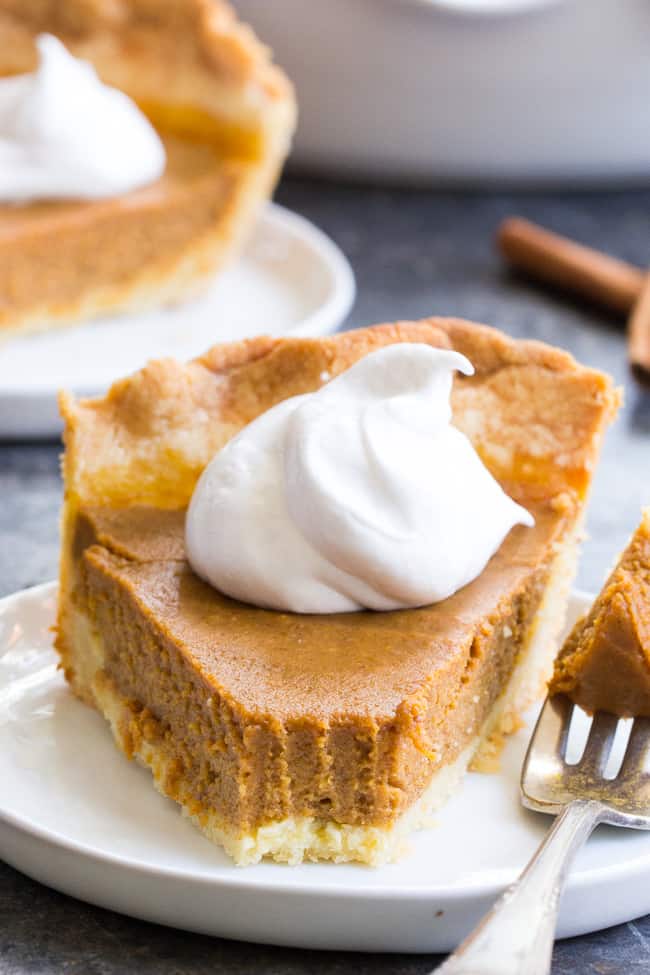 This classic Paleo Pumpkin Pie is just as delicious as any traditional pie you've made!  A buttery, flaky paleo pie crust is filled with creamy dairy free pumpkin custard and baked to perfection for a delectable holiday dessert.  Great with coconut whipped cream, gluten free, grain free, family approved!